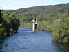 A pier of an old railway bridge in the river.