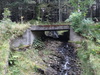 A bridge carrying a track from the road.