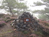 A memorial cairn beside the track.