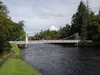 The suspension bridge that leads to the island in the middle of the river.