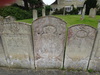 Gravestones on the boundary of Ketton churchyard.