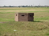 A pillbox beside the river.