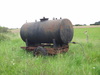 A water tank beside the path.