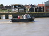 A fishing boat returning to port.