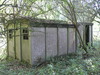 Old huts beside the railway trackbed.