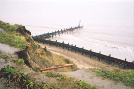 AC09	A washed-away section of path on the clifftop north of Corton.