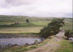 AK13	The ramshackle bridgeover the Water of Tulla at Barravourich, with the abondoned farmhouse behind.