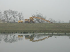 P1050353	A nice reflection of a digger in the river near Cowbit House.