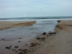 P2002A070041	The place where Embleton Burn runs into Embleton Bay - and where I got my feet wet. 