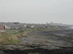 P2002A080015	The view over Craster towards Dunstanburgh Castle. 