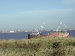 P2002A240017	An old boat rusting on the foreshore between New Holland and Goxhall Haven. 