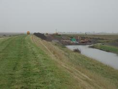 P2002A290038	A view along the sea bank towards the sluice that was being repaired. 