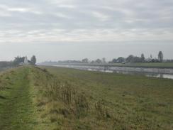 P2002A310006	The view back towards the lighthouse along the eastern bank of the Nene. 