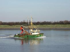 P2002A310026	A trawler heading upstream. 