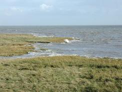 P2002B220047	Waves breaking over the marshes. 