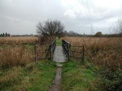 P2002B280046	The bridge across a stream on the marshland near Mucking. 