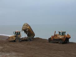 P20021010056	Dumper trucks replenishing the beach at Seaford.  