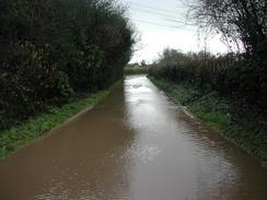 P2002C260067	A flooded section of road to the southeast of Eling. 