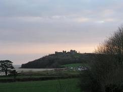 P20033120031	Looking down over Llansteffan, with the castle on top of the hill.