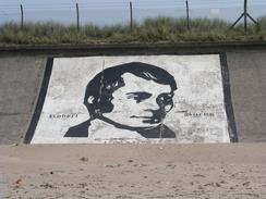 P20035313494	A painting of Robert Burns painted on the seawall.