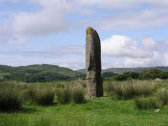 P20036284726	A large standing stone beside the A816 near Kintraw.