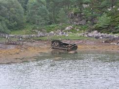 P20037225694	A derelcit boat by the bay in Plockton.