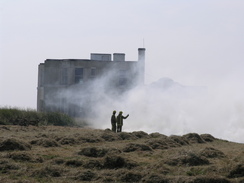 P20057166777	A grass fire at the top of the cliffs.