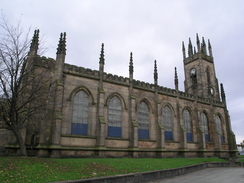 P2005A297895	A church beside Bolton ralway station.