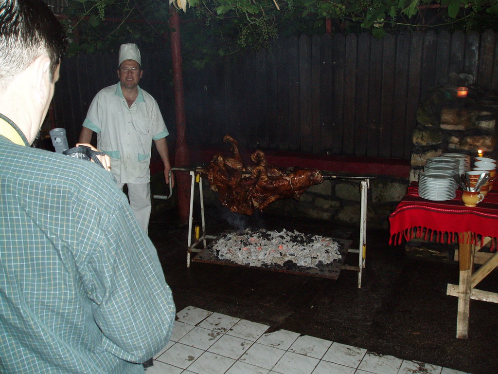 The pig being roasted.