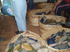 P20067040085	A stack of slippers in Bran Castle.