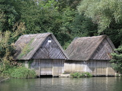 P20069094211	Boathouses by the river.