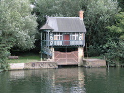 P20069094240	A pretty boathouse on the other side of the river.