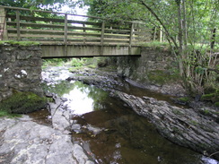 P20069275138	A footbridge over a tributary to the river.