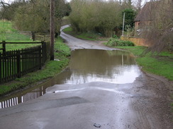 P20071136975	A flooded road in Winwick.