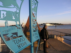 P20081122235	Sencan by the sign marking the start of the South West Coast Path.