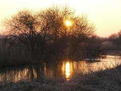 P20082133555	The sun setting over the river.