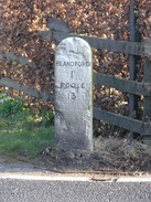 P20082183602	A milestone beside the A350.