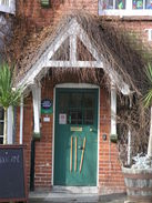 P20082273749	The doorway leading into the Cricketers pub in Iwerne Courtney.