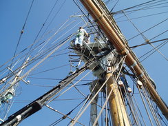 P20089200079	Natasha doing the 'up and over' on the main mast.