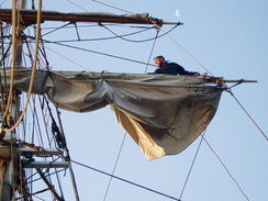 P20089225421	Getting ready to furl the sails.