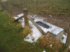 P20091080060	An iced-over trough near Yavington Farm.