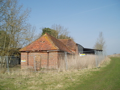 P20093180035	An old farm by the track.