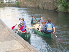 P20093180140	Children rowing on the canal.