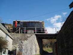 P20103150091	A train passing over a bridge in Corfe Castle.