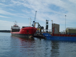 P20107190011	A ship offloading gravel in Poole.