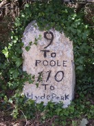 P20107190085	A milestone - 9 to Poole, 110 to Hyde Park.