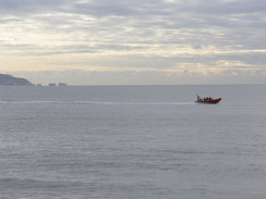 P20111021278	The lifeboat racing past.