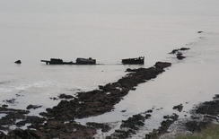 P20111201941	The wreck of a ship on the foreshore.