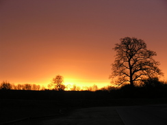P20112012451	The sun rising over Blandford Forum.
