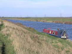 P201120113143264	A canal boat moored by the river.